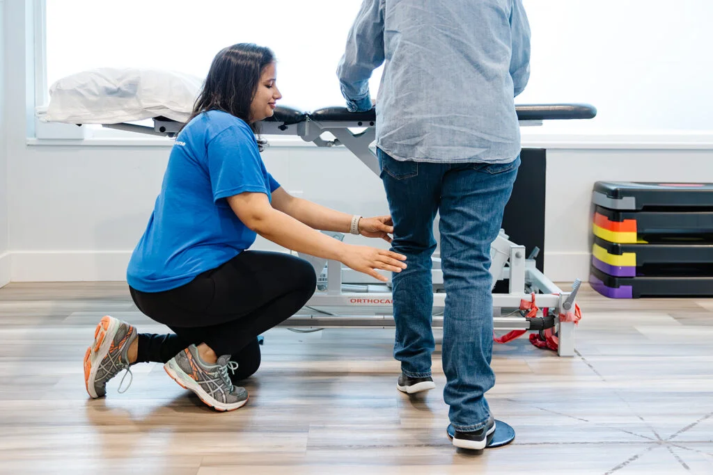 A practitioner guiding an osteoarthritis patient through the GLA:D Canada education and exercise program.