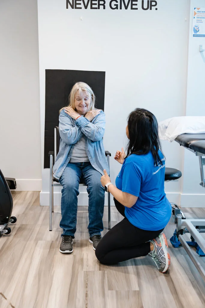 A certified physiotherapist training a senior patient during a GLA:D Canada structured exercise session.
