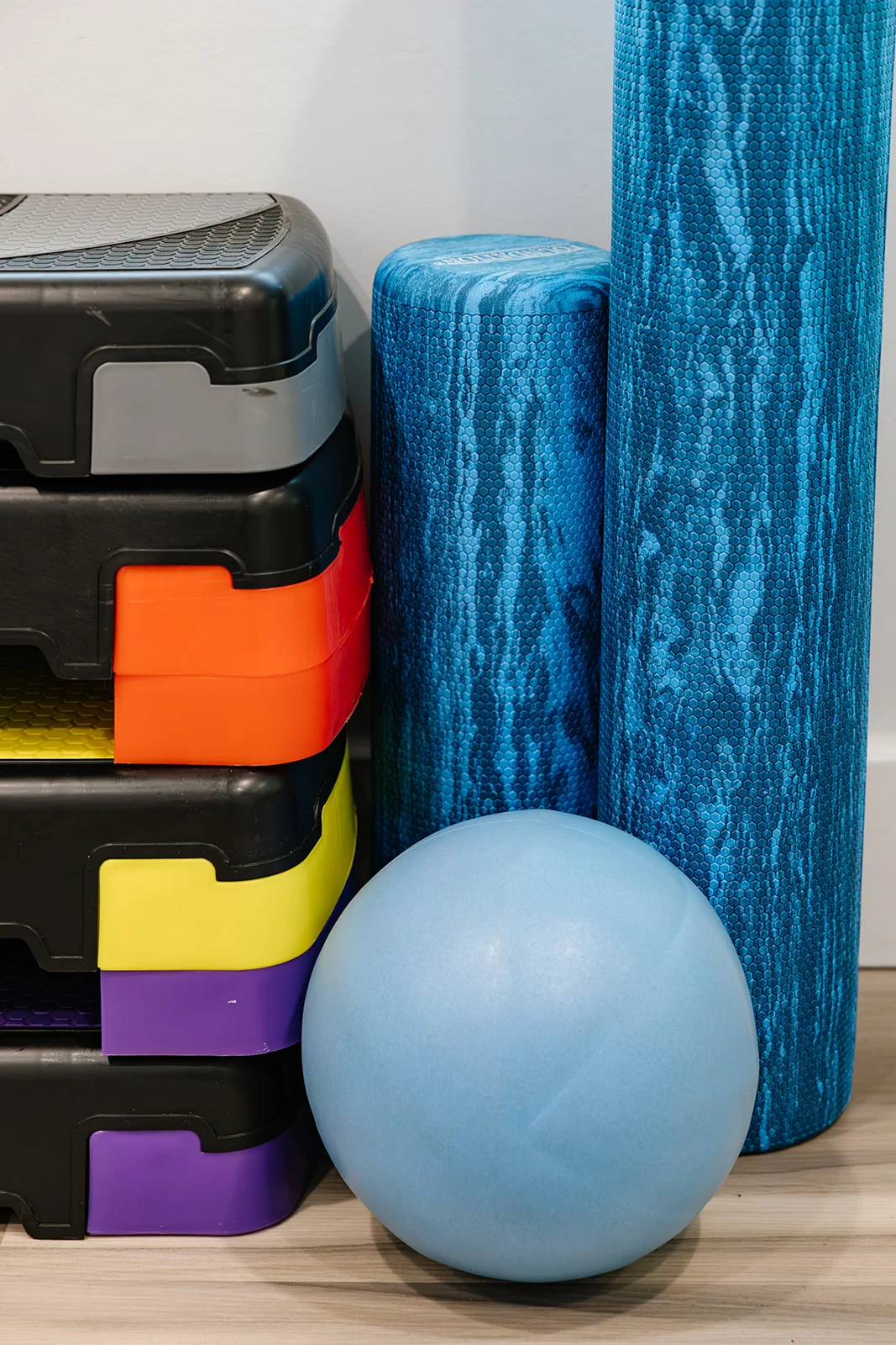 Professional physiotherapy and rehabilitation gym equipment including foam rollers and balance balls at Belmont Physiotherapy & Health Clinic in Langley BC.